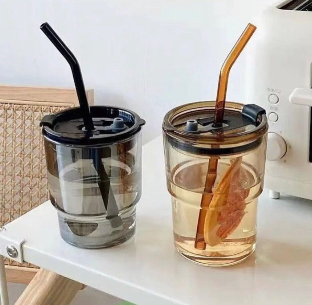 Transparent glass mug with straw